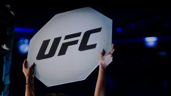 An Octagon Girl announces a round in the UFC middleweight championship fight during the UFC 276 event at T-Mobile Arena on July 02, 2022 in Las Vegas, Nevada. (Photo by Cooper Neill/Zuffa LLC)