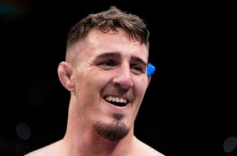 Tom Aspinall of England celebrates his submission victory over Alexander Volkov of Russia in a heavyweight fight during the UFC Fight Night event at O2 Arena on March 19, 2022 in London, England. (Photo by Chris Unger/Zuffa LLC)