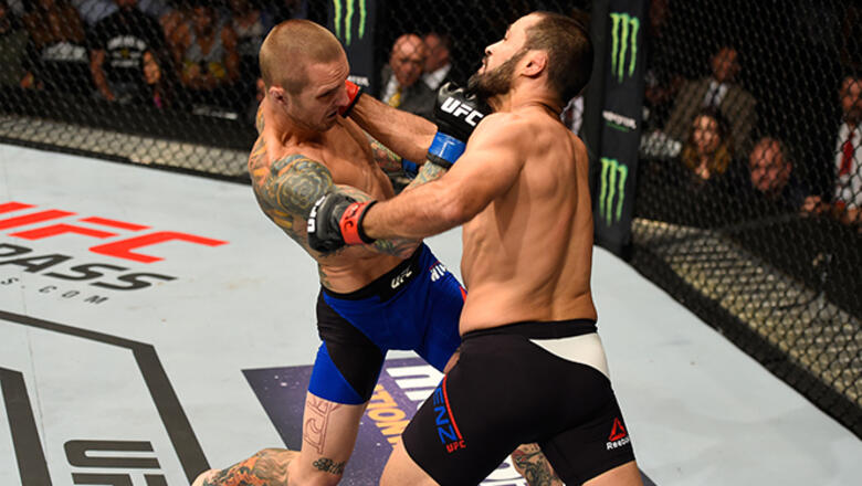 CHICAGO, IL - JULY 23: (L-R) Eddie Wineland punches Frankie Saenz in their bantamweight bout during the UFC Fight Night event at the United Center on July 23, 2016 in Chicago, Illinois. (Photo by Josh Hedges/Zuffa LLC/Zuffa LLC via Getty Images)
