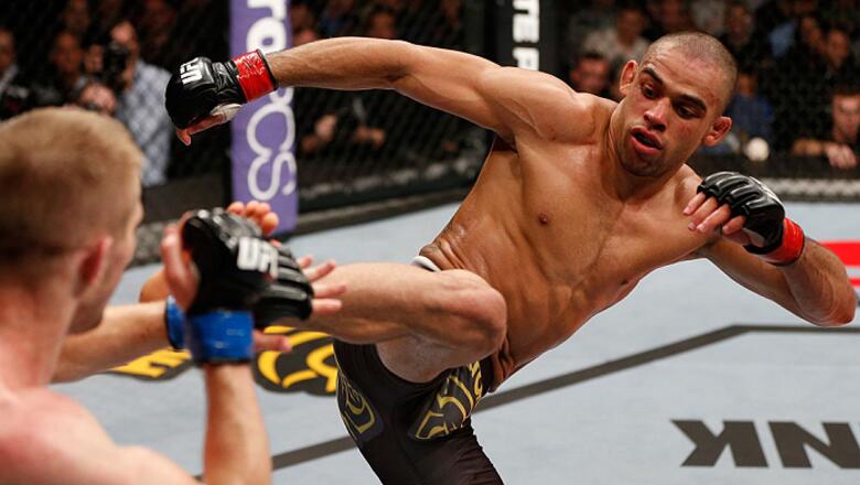 LONDON, ENGLAND - FEBRUARY 16:  (R-L) Renan Barao kicks Michael McDonald in their interim bantamweight title fight during the UFC on Fuel TV event on February 16, 2013 at Wembley Arena in London, England.  (Photo by Josh Hedges/Zuffa LLC/Zuffa LLC via Get