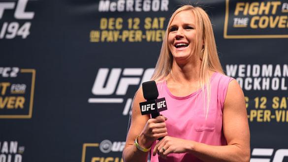 LAS VEGAS, NV - DECEMBER 11: UFC women's bantamweight champion Holly Holm interacts with fans during a Q&A session before the UFC 194 weigh-in inside MGM Grand Garden Arena on December 10, 2015 in Las Vegas, Nevada. (Photo by Josh Hedges/Zuffa LLC/Zuffa L