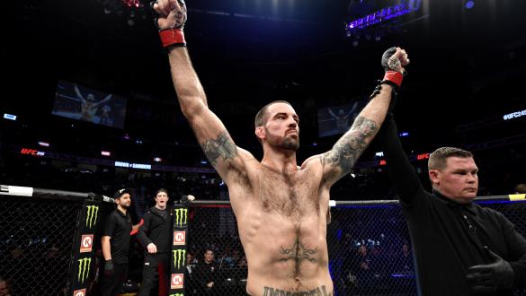 Matt Brown raises his hands in victory over Ben Saunders in their welterweight bout during the UFC 245.