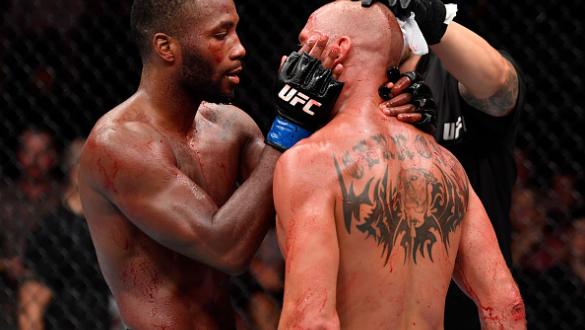 SINGAPORE - JUNE 23:  (R-L) Donald Cerrone and Leon Edwards of Jamaica congratulate each other after the conclusion of their welterweight bout during the UFC Fight Night event at the Singapore Indoor Stadium on June 23, 2018 in Singapore. (Photo by Jeff B