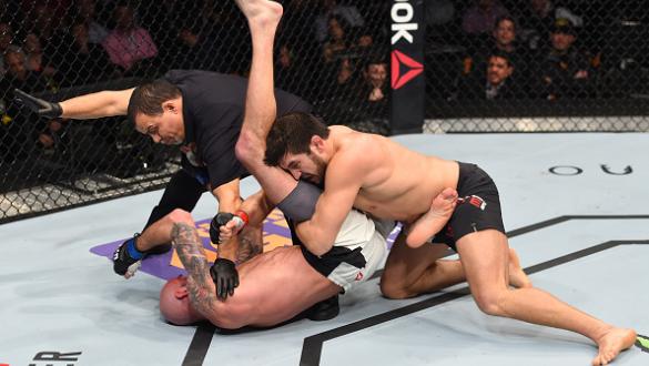 BOSTON, MA - JANUARY 17:  The referee stops the bout as Patrick Cote (R) of Canada defeats Ben Saunders (L) in their welterweight bout during the UFC Fight Night event inside TD Garden on January 17, 2016 in Boston, Massachusetts. (Photo by Jeff Bottari/Z