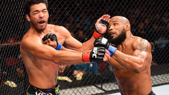 HOLLYWOOD, FL - JUNE 27:  (R-L) Yoel Romero of Cuba punches Lyoto Machida of Brazil in their middleweight during the UFC Fight Night event at the Hard Rock Live on June 27, 2015 in Hollywood, Florida. (Photo by Josh Hedges/Zuffa LLC/Zuffa LLC via Getty Im