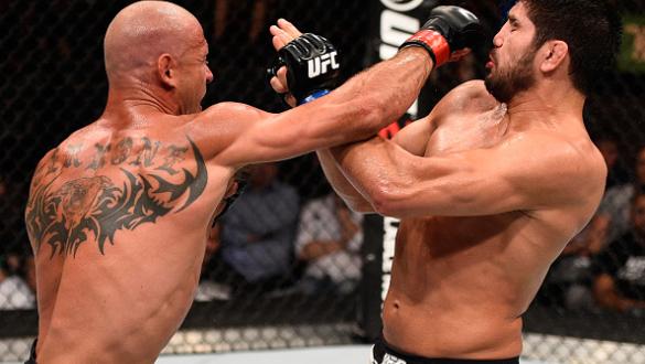 OTTAWA, ON - JUNE 18:   (L-R) Donald Cerrone of the United States punches Patrick Cote of Canada in their welterweight bout during the UFC Fight Night event inside the TD Place Arena on June 18, 2016 in Ottawa, Ontario, Canada. (Photo by Jeff Bottari/Zuff
