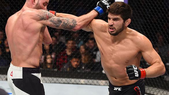 BOSTON, MA - JANUARY 17:  (R-L) Patrick Cote of Canada punches Ben Saunders in their welterweight bout during the UFC Fight Night event inside TD Garden on January 17, 2016 in Boston, Massachusetts. (Photo by Jeff Bottari/Zuffa LLC/Zuffa LLC via Getty Ima