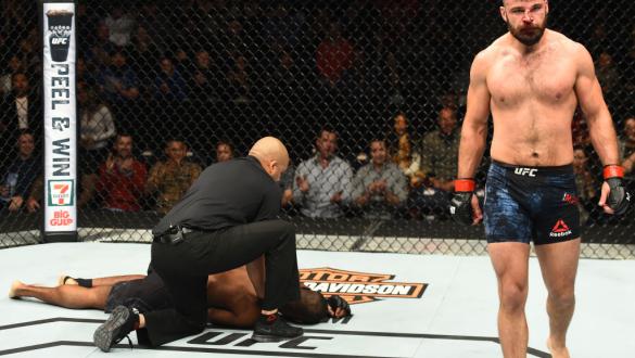 WINNIPEG, CANADA - DECEMBER 16:  (R-L) Julian Marquez submits Darren Stewart of England in their middleweight bout during the UFC Fight Night event at Bell MTS Place on December 16, 2017 in Winnipeg, Manitoba, Canada. (Photo by Josh Hedges/Zuffa LLC/Zuffa