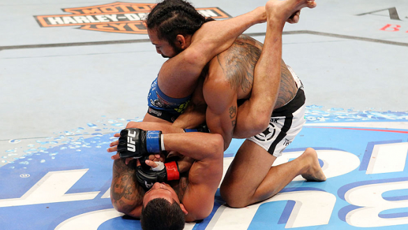 MILWAUKEE, WI - AUGUST 31:  (L-R) Anthony Pettis puts Benson Henderson in an armbar in their UFC lightweight championship bout at BMO Harris Bradley Center on August 31, 2013 in Milwaukee, Wisconsin. (Photo by Ed Mulholland/Zuffa LLC/Zuffa LLC via Getty I