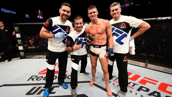 OTTAWA, ON - JUNE 18:   Stephen Thompson of the United States takes a picture with his team and celebrates his victory over Rory MacDonald of Canada in their welterweight bout during the UFC Fight Night event inside the TD Place Arena on June 18, 2016 in 