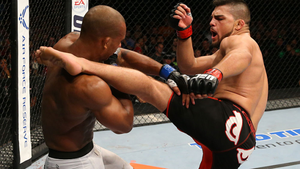 SAN ANTONIO, TX - JUNE 28:  (R-L) Kelvin Gastelum kicks Nico Musoke in their welterweight bout at the AT&T Center on June 28, 2014 in San Antonio, Texas. (Photo by Ed Mulholland/Zuffa LLC/Zuffa LLC via Getty Images)
