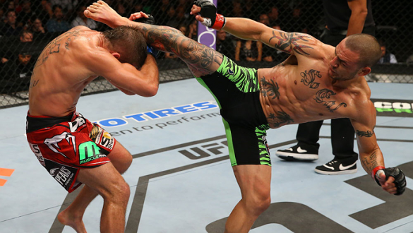 SAN ANTONIO, TX - JUNE 28:  (R-L) Cub Swanson kicks Jeremy Stephens in their featherweight bout at the AT&T Center on June 28, 2014 in San Antonio, Texas. (Photo by Ed Mulholland/Zuffa LLC/Zuffa LLC via Getty Images)