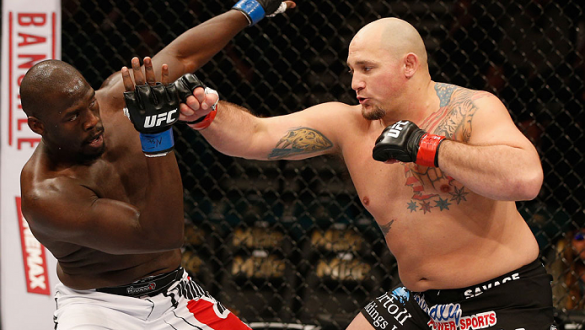 LAS VEGAS, NV - JANUARY 03:  (R-L) Shawn Jordan punches Jared Cannonier in their heavyweight bout during the UFC 182 event at the MGM Grand Garden Arena on January 3, 2015 in Las Vegas, Nevada.  (Photo by Josh Hedges/Zuffa LLC/Zuffa LLC via Getty Images)