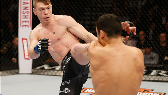 LAS VEGAS, NV - JANUARY 03:  (L-R) Paul Felder kicks Danny Castillo in their lightweight bout during the UFC 182 event at the MGM Grand Garden Arena on January 3, 2015 in Las Vegas, Nevada.  (Photo by Josh Hedges/Zuffa LLC/Zuffa LLC via Getty Images)