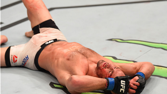 LAS VEGAS, NV - DECEMBER 12: Luke Rockhold reacts to his victory over Chris Weidman in their UFC middleweight championship bout during the UFC 194 event inside MGM Grand Garden Arena on December 12, 2015 in Las Vegas, Nevada.  (Photo by Josh Hedges/Zuffa 