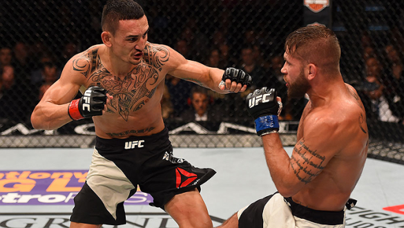 LAS VEGAS, NV - DECEMBER 12: (R-L) Jeremy Stephens kicks Max Holloway in their featherweight bout during the UFC 194 event inside MGM Grand Garden Arena on December 12, 2015 in Las Vegas, Nevada.  (Photo by Josh Hedges/Zuffa LLC/Zuffa LLC via Getty Images