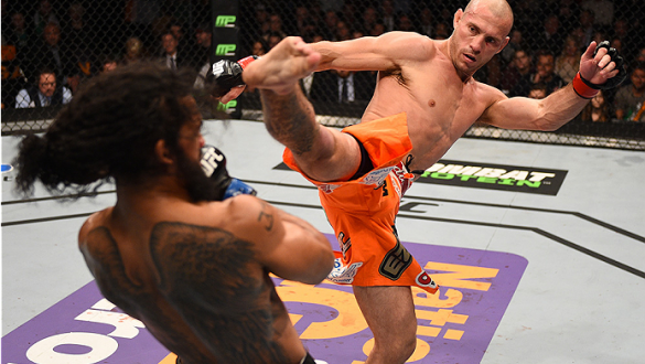 BOSTON, MA - JANUARY 18:  (R-L) Donald Cerrone kicks Benson Henderson in their lightweight fight during the UFC Fight Night event at the TD Garden on January 18, 2015 in Boston, Massachusetts. (Photo by Jeff Bottari/Zuffa LLC/Zuffa LLC via Getty Images)