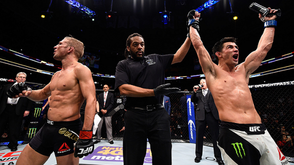 BOSTON, MA - JANUARY 17:  Dominick Cruz (R) celebrates his split-decision victory over TJ Dillashaw (L) in their UFC bantamweight championship bout during the UFC Fight Night event inside TD Garden on January 17, 2016 in Boston, Massachusetts. (Photo by J
