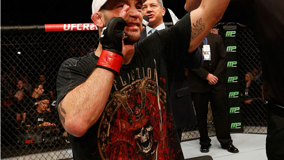 AUSTIN, TX - NOVEMBER 22:  Frankie Edgar celebrates after his fifth-round submission victory over Cub Swanson in their featherweight bout during the UFC Fight Night event at The Frank Erwin Center on November 22, 2014 in Austin, Texas.  (Photo by Josh Hed