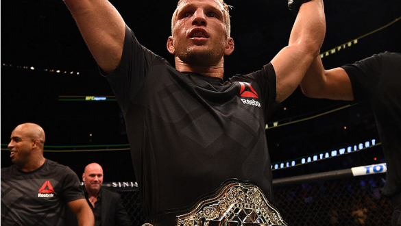 CHICAGO, IL - JULY 25:   TJ Dillashaw celebrates after his TKO victory over Renan Barao of Brazil UFC bantamweight championship bout during the UFC event at the United Center on July 25, 2015 in Chicago, Illinois. (Photo by Jeff Bottari/Zuffa LLC/Zuffa LL