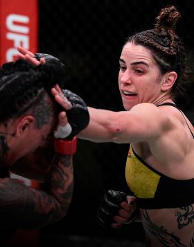 Norma Dumont of Brazil punches Ashlee Evans-Smith in their women's bantamweight bout during the UFC Fight Night at UFC APEX on November 28, 2020 in Las Vegas, Nevada. (Photo by Chris Unger/Zuffa LLC)