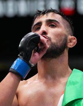 Saidyokub Kakhramonov of Uzbekistan reacts after his third-round technical submission over Trevin Jones of Guam in their bantamweight bout at UFC Fight Night: Cannonier vs Gastelum on August 21 2021 in Las Vegas Nevada (Photo by Chris Unger/Zuffa LLC)