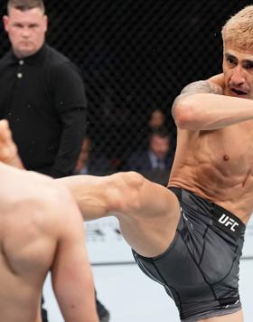 Luis Saldana kicks Bruno Souza of Brazil in a featherweight fight during the UFC Fight Night event at Nationwide Arena on March 26, 2022 in Columbus, Ohio. (Photo by Josh Hedges/Zuffa LLC)