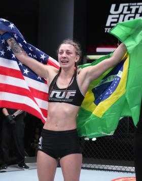 Juliana Miller celebrates her victory over Claire Guthrie in their women's flyweight fight during the filming of The Ultimate Fighter at UFC APEX on February 24, 2022 in Las Vegas, Nevada. (Photo by Chris Unger/Zuffa LLC)