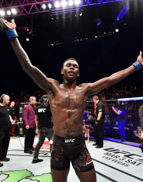 Israel Adesanya of Nigeria celebrates his victory over Rob Wilkinson of Australia in their middleweight bout during the UFC 221 event at Perth Arena on February 11, 2018 in Perth, Australia. (Photo by Jeff Bottari/Zuffa Getty Images)