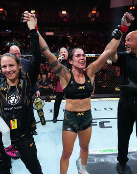 Amanda Nunes celebrates with her family after defeating Irene Aldana and retiring at UFC 289