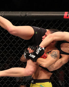 Jessica Andrade of Brazil attempts to slam Rose Namajunas in their women's strawweight championship bout during the UFC 237 event at Jeunesse Arena on May 11, 2019 in Rio De Janeiro, Brazil