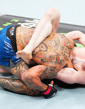 Melquizael Costa of Brazil secures a guillotine choke submission against Andre Fili in a featherweight fight during the UFC Fight Night event at Climate Pledge Arena on February 22, 2025 in Seattle, Washington. (Photo by Chris Unger/Zuffa LLC)