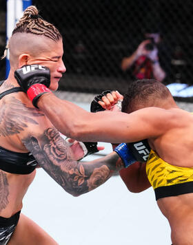 Priscila Cachoeira of Brazil and Josiane Nunes of Brazil trade punches in a bantamweight fight during the UFC Fight Night event at UFC APEX on March 15, 2025 in Las Vegas, Nevada. (Photo by Chris Unger/Zuffa LLC)