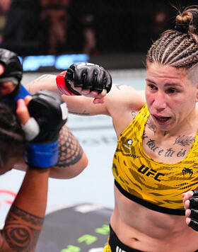  Karol Rosa of Brazil punches Nora Cornolle of France in a bantamweight fight during the UFC Fight Night event at UFC APEX on August 02, 2025 in Las Vegas, Nevada. (Photo by Chris Unger/Zuffa LLC)
