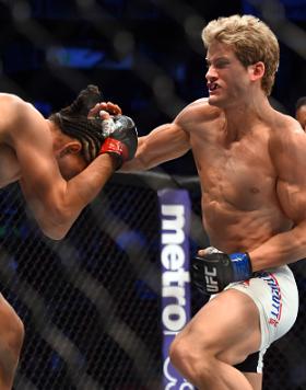 HOUSTON, TX - OCTOBER 03:  (R-L) Sage Northcutt punches Francisco Trevino in their lightweight bout during the UFC 192 event at the Toyota Center on October 3, 2015 in Houston, Texas. (Photo by Jeff Bottari/Zuffa LLC/Zuffa LLC via Getty Images)