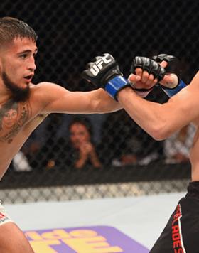 LAS VEGAS, NV - APRIL 23: (L-R) Sergio Pettis punches Chris Kelades in their flyweight bout during the UFC 197 event inside MGM Grand Garden Arena on April 23, 2016 in Las Vegas, Nevada. (Photo by Josh Hedges/Zuffa LLC/Zuffa LLC via Getty Images)