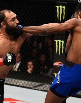 LAS VEGAS, NV - DECEMBER 30: (L-R) Johny Hendricks punches Neil Magny in their welterweight bout during the UFC 207 event at T-Mobile Arena on December 30, 2016 in Las Vegas, Nevada.  (Photo by Jeff Bottari/Zuffa LLC/Zuffa LLC via Getty Images)