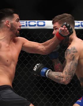 LAS VEGAS, NV - DECEMBER 30: (L-R) Dominick Cruz punches Cody Garbrandt in their UFC bantamweight championship bout during the UFC 207 event on December 30, 2016 in Las Vegas, Nevada.  (Photo by Christian Petersen/Getty Images)