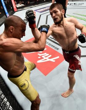 LAS VEGAS, NV - DECEMBER 30:  (R-L) Khabib Nurmagomedov of Russia punches Edson Barboza of Brazil in their lightweight bout during the UFC 219 event inside T-Mobile Arena on December 30, 2017 in Las Vegas, Nevada. (Photo by Jeff Bottari/Zuffa LLC/Zuffa LL