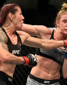 LAS VEGAS, NV - DECEMBER 30:  (L-R) Cris Cyborg of Brazil punches Holly Holm in their women's featherweight bout during the UFC 219 event inside T-Mobile Arena on December 30, 2017 in Las Vegas, Nevada. (Photo by Brandon Magnus/Zuffa LLC)