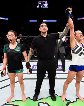 HOUSTON, TX - FEBRUARY 04:  (R-L) Felice Herrig celebrates her victory over Alexa Grasso of Mexico in their women's strawweight bout during the UFC Fight Night event at the Toyota Center on February 4, 2017 in Houston, Texas. (Photo by Jeff Bottari/Zuffa 