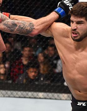 BOSTON, MA - JANUARY 17:  (R-L) Patrick Cote of Canada punches Ben Saunders in their welterweight bout during the UFC Fight Night event inside TD Garden on January 17, 2016 in Boston, Massachusetts. (Photo by Jeff Bottari/Zuffa LLC/Zuffa LLC via Getty Ima