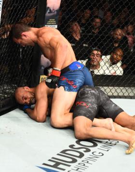 PITTSBURGH, PA - SEPTEMBER 16:  (L-R) Luke Rockhold controls the body and punches David Branch in their middleweight bout during the UFC Fight Night event inside the PPG Paints Arena on September 16, 2017 in Pittsburgh, Pennsylvania. (Photo by Josh Hedges