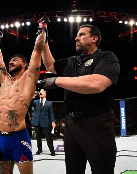 SALT LAKE CITY, UT - AUGUST 06:  (L-R) Cub Swanson celebrates his victory over Tatsuya Kawajiri of Japan in their featherweight bout during the UFC Fight Night event at Vivint Smart Home Arena on August 6, 2016 in Salt Lake City, Utah. (Photo by Jeff Bott