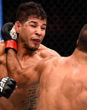 JULY 13: (R-L) Rani Yahya of Brazil punches Matthew Lopez in their bantamweight bout during the UFC Fight Night event on July 13, 2016 at Denny Sanford Premier Center in Sioux Falls, South Dakota. (Photo by Jeff Bottari/Zuffa LLC/Zuffa LLC via Getty Image