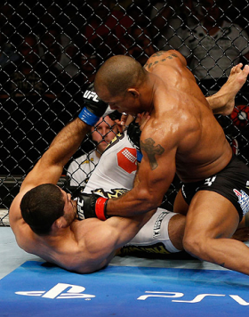 GOLD COAST, AUSTRALIA - DECEMBER 15:  (R-L) Hector Lombard punches Rousimar Palhares during their middleweight fight at the UFC on FX event on December 15, 2012  at Gold Coast Convention and Exhibition Centre in Gold Coast, Australia.  (Photo by Josh Hedg