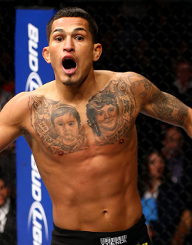 CHICAGO, IL - JANUARY 26:  Anthony Pettis celebrates defeating Donald Cerrone during their Lightweight Bout part of UFC on FOX at United Center on January 26, 2013 in Chicago, Illinois.  (Photo by Al Bello/Zuffa LLC/Zuffa LLC Via Getty Images)