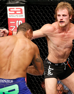 LONDON, ENGLAND - FEBRUARY 16:  (R-L) Gunnar Nelson punches Jorge Santiago in their welterweight fight during the UFC on Fuel TV event on February 16, 2013 at Wembley Arena in London, England.  (Photo by Josh Hedges/Zuffa LLC/Zuffa LLC via Getty Images)