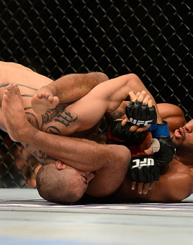 SEATTLE, WA - JULY 27: Demetrious Johnson (right) attempts to submit John Moraga in their flyweight championship bout during the UFC on FOX event at Key Arena on July 27, 2013 in Seattle, Washington. (Photo by Jeff Bottari/Zuffa LLC/Zuffa LLC via Getty Im