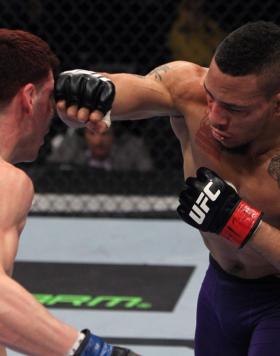 NASHVILLE, TN - JANUARY 20:  (R-L) Mike Easton punches Jared Papazian during the UFC on FX event at Bridgestone Arena on January 20, 2012 in Nashville, Tennessee.  (Photo by Josh Hedges/Zuffa LLC/Zuffa LLC via Getty Images)